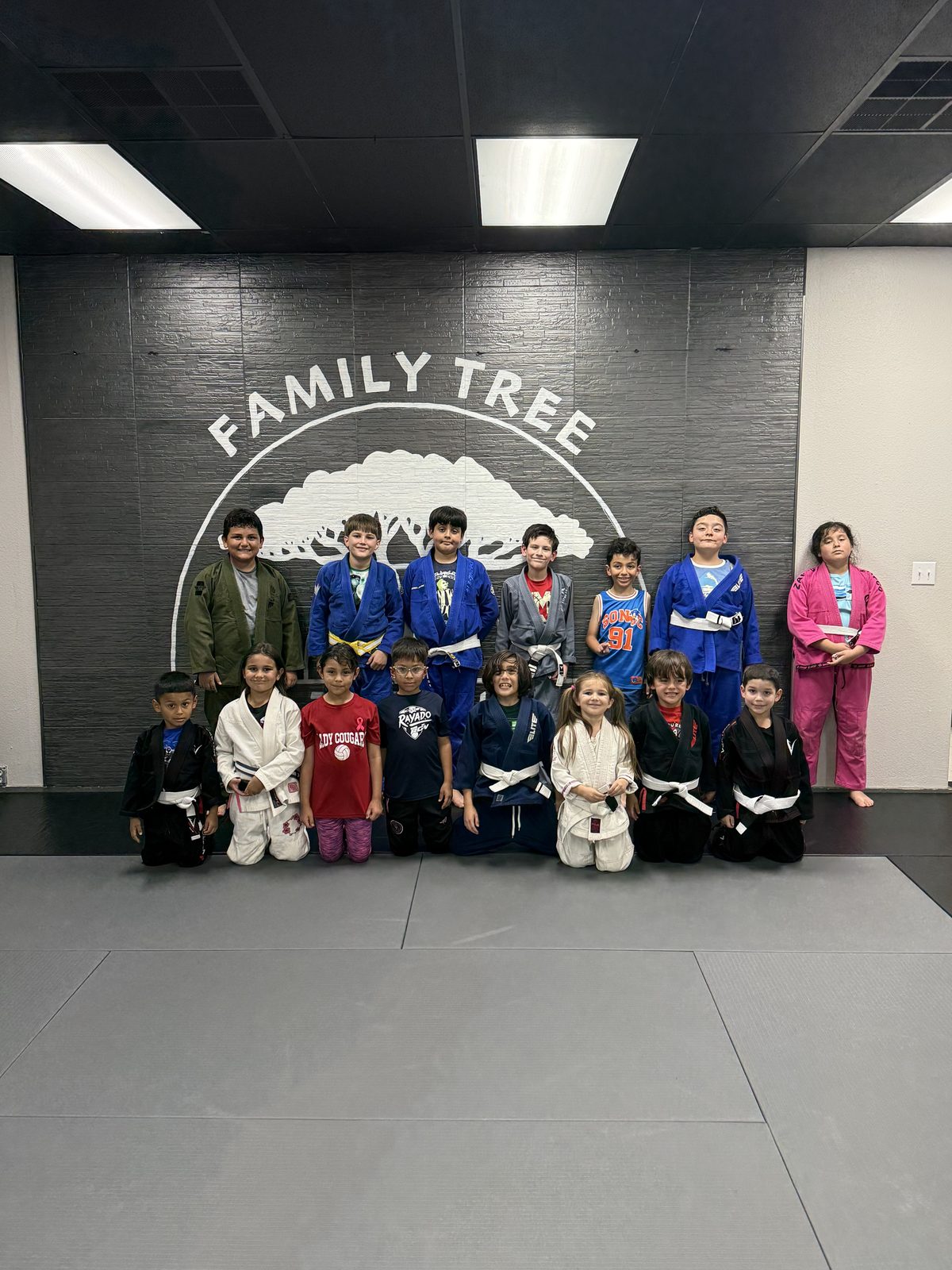 Group photo in front of the Family Tree wall